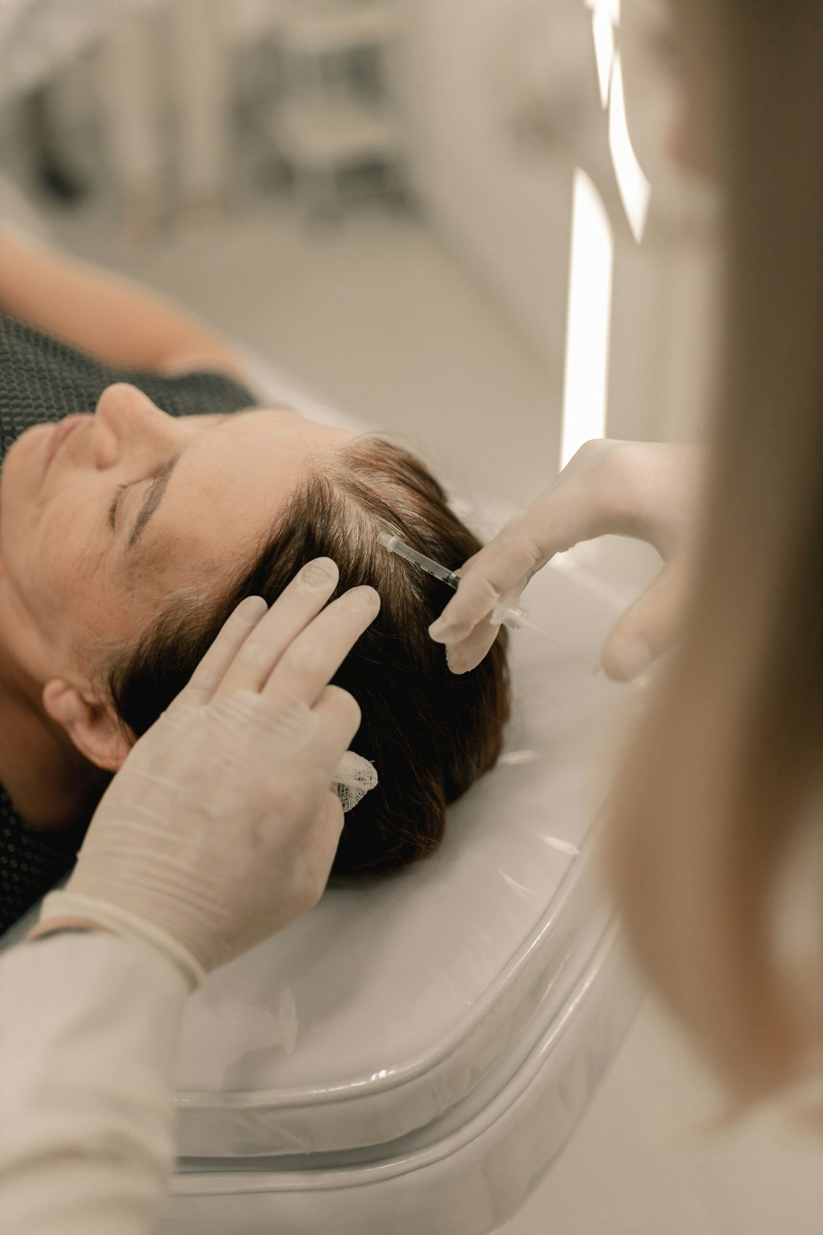 Scalp massager doing micro needling and prp